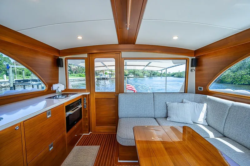 Slide: The Image of Luxurious interior of 2024 Grand Banks 44 Eastbay yacht with elegant wood finish. - 17