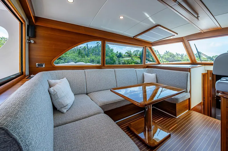 Slide: The Image of Luxurious interior of 2024 Grand Banks 44 Eastbay yacht with elegant seating and wooden finishes. - 18