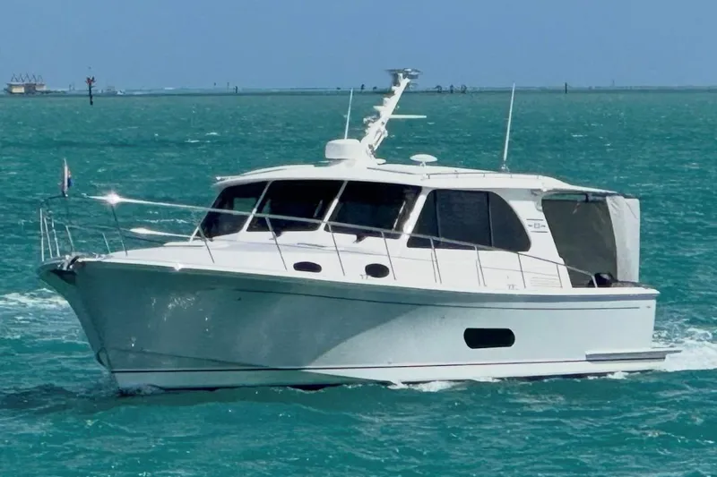 The Image of 2024 Grand Banks 44 Eastbay cruising on turquoise waters. - 2