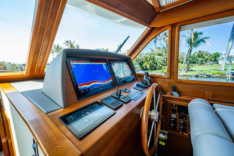 Slide: The Image of Helm of 2024 Grand Banks 44 Eastbay yacht with advanced navigation displays. - 23