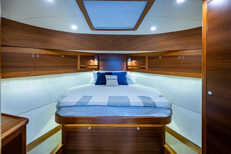 Slide: The Image of Luxurious cabin interior of 2024 Grand Banks 44 Eastbay yacht with elegant wood finish. - 25