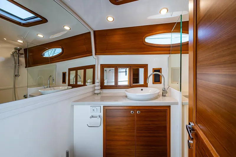 Slide: The Image of Luxurious bathroom interior of 2024 Grand Banks 44 Eastbay yacht with modern fixtures. - 28