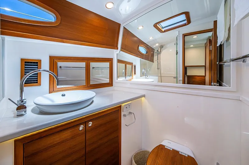 Slide: The Image of Luxurious bathroom interior of 2024 Grand Banks 44 Eastbay yacht with modern fixtures. - 34