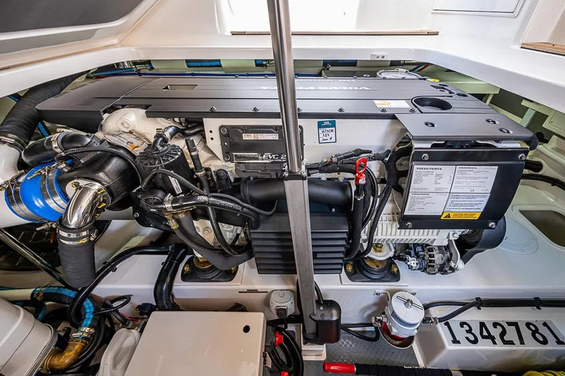 Slide: The Image of Engine compartment of 2024 Grand Banks 44 Eastbay yacht, featuring a Volvo Penta engine. - 35