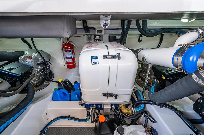 Slide: The Image of Engine room of 2024 Grand Banks 44 Eastbay with mechanical components and fire extinguisher. - 37