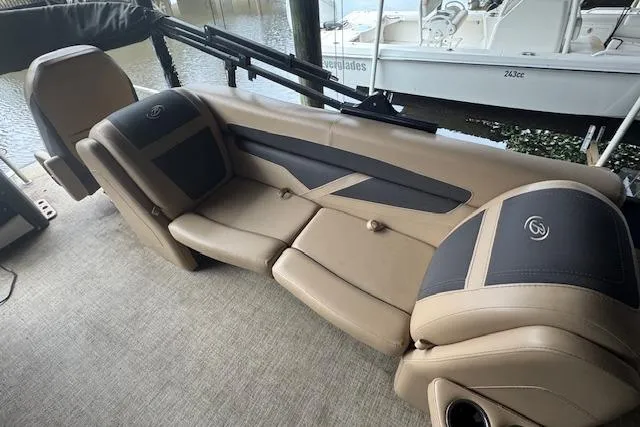 Slide: The Image of 2023 Barletta Cabrio 24CC boat interior with luxurious tan seating and modern design. - 14