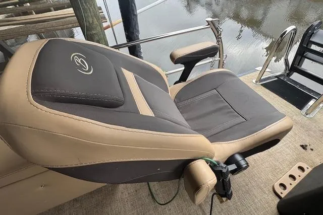 Slide: The Image of Captain's chair on 2023 Barletta Cabrio 24CC pontoon boat, featuring sleek design and comfort. - 17