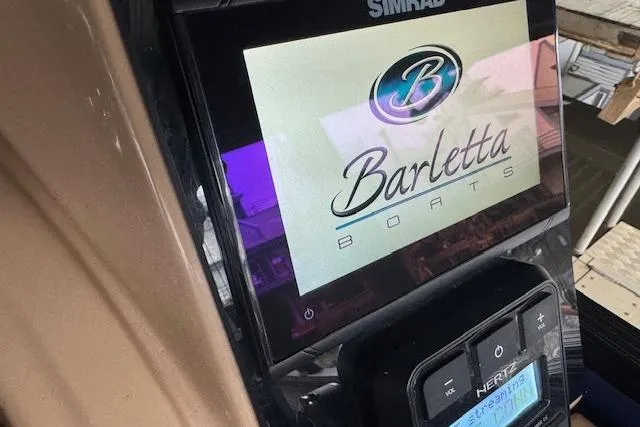 Slide: The Image of Simrad display on 2023 Barletta Cabrio 24CC boat dashboard. - 24