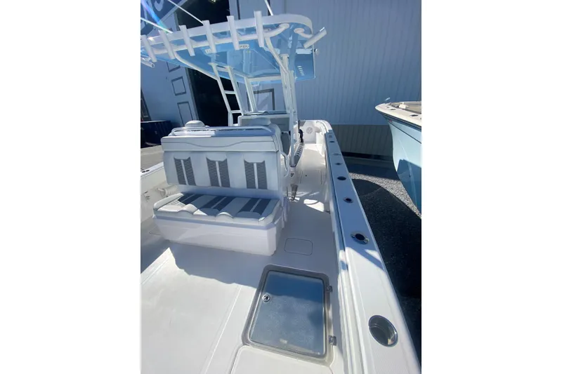 Slide: The Image of 2023 Invincible 33 Catamaran interior with seating and rod holders, showcasing sleek design. - 10