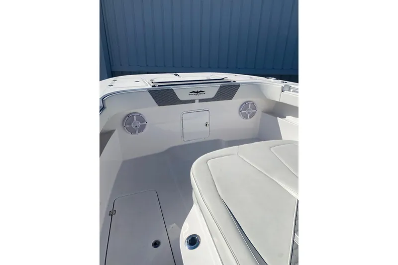 Slide: The Image of 2023 Invincible 33 Catamaran interior with speakers and seating, showcasing modern design. - 19