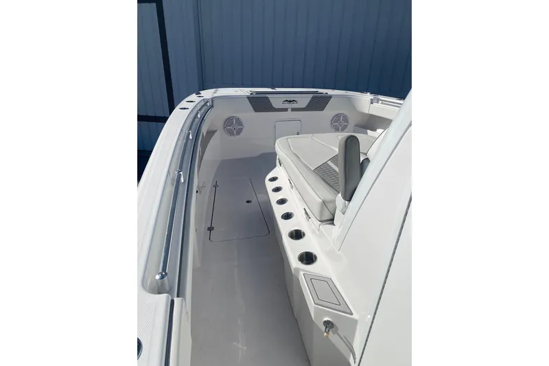 Slide: The Image of 2023 Invincible 33 Catamaran interior with seating and cup holders. - 20