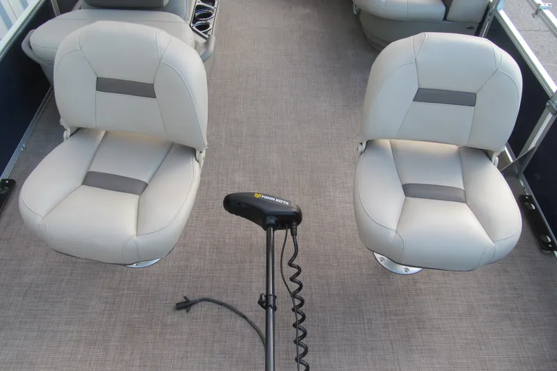 Slide: The Image of 2024 Sun Tracker Bass Buggy 16 XL Select interior with two cushioned seats and a trolling motor. - 10