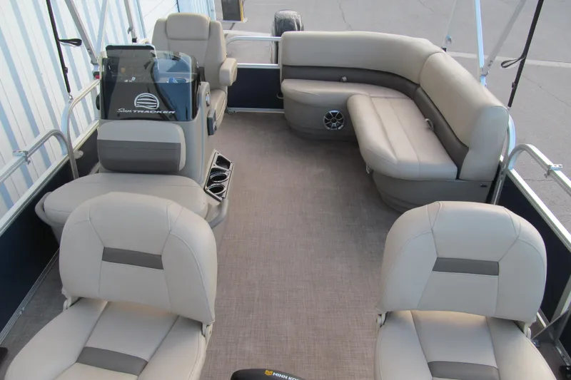 Slide: The Image of 2024 Sun Tracker Bass Buggy 16 XL Select interior with plush seating and modern console. - 11