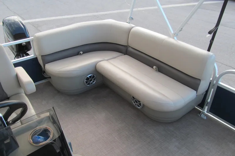 Slide: The Image of 2024 Sun Tracker Bass Buggy 16 XL Select pontoon boat seating area with beige upholstery. - 14