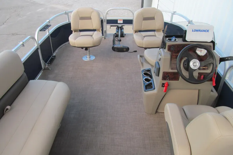 Slide: The Image of 2024 Sun Tracker Bass Buggy 16 XL Select interior with seating and steering console. - 5