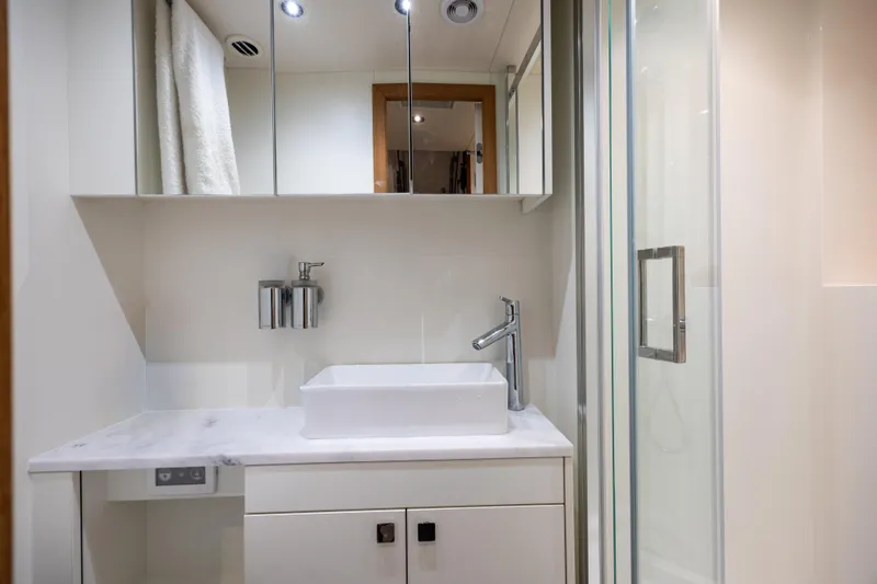 Slide: The Image of Luxurious bathroom in 2025 Sunseeker 88 Yacht with modern fixtures and sleek design. - 13