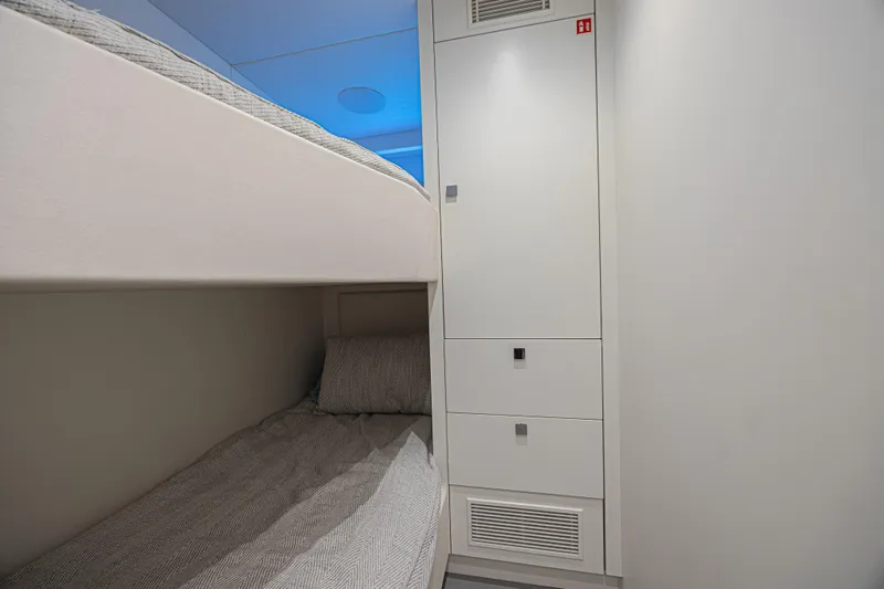 Slide: The Image of Bunk beds and storage in 2025 Sunseeker 88 Yacht cabin interior. - 15