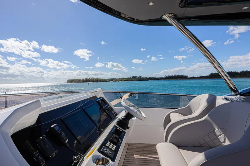Slide: The Image of Luxury Sunseeker 88 Yacht 2025 helm with ocean view and modern controls. - 18