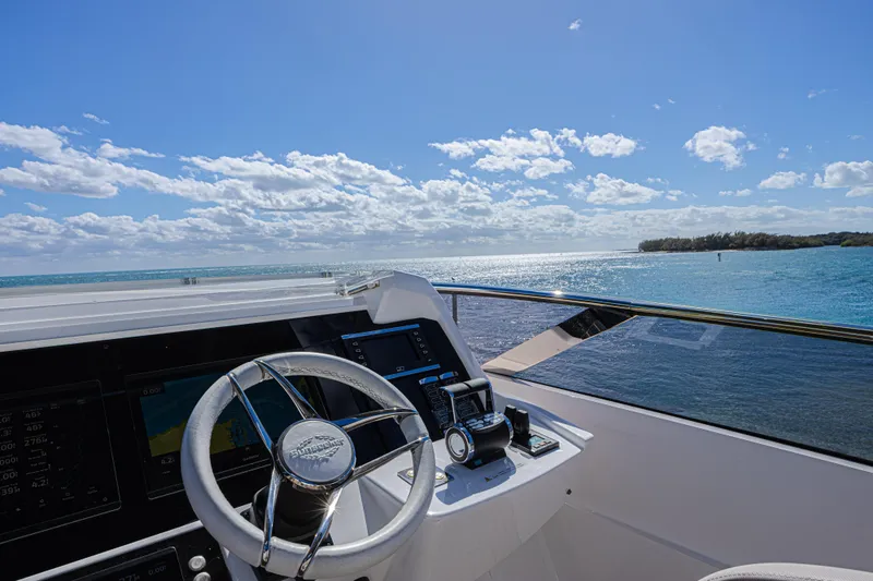 Slide: The Image of Helm of 2025 Sunseeker 88 Yacht overlooking serene ocean view. - 19