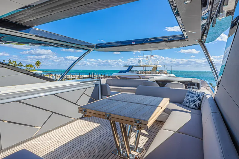 Slide: The Image of Luxurious 2025 Sunseeker 88 Yacht deck with elegant seating and ocean view. - 27