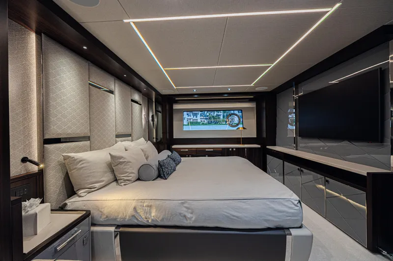 Slide: The Image of Luxurious bedroom interior of 2025 Sunseeker 88 Yacht with modern design and ambient lighting. - 29