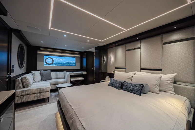 Slide: The Image of Luxurious interior of 2025 Sunseeker 88 Yacht, featuring elegant bedroom and seating area. - 31