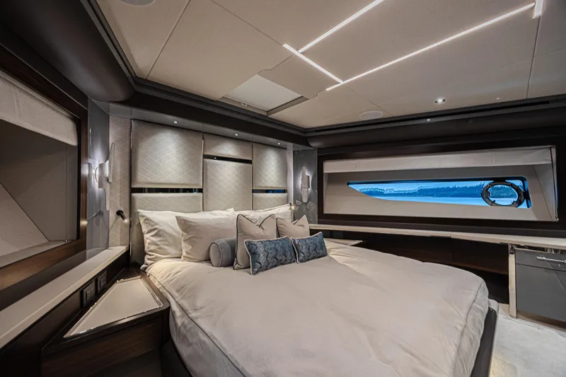 Slide: The Image of Luxurious bedroom interior of 2025 Sunseeker 88 Yacht with elegant design and scenic window view. - 39
