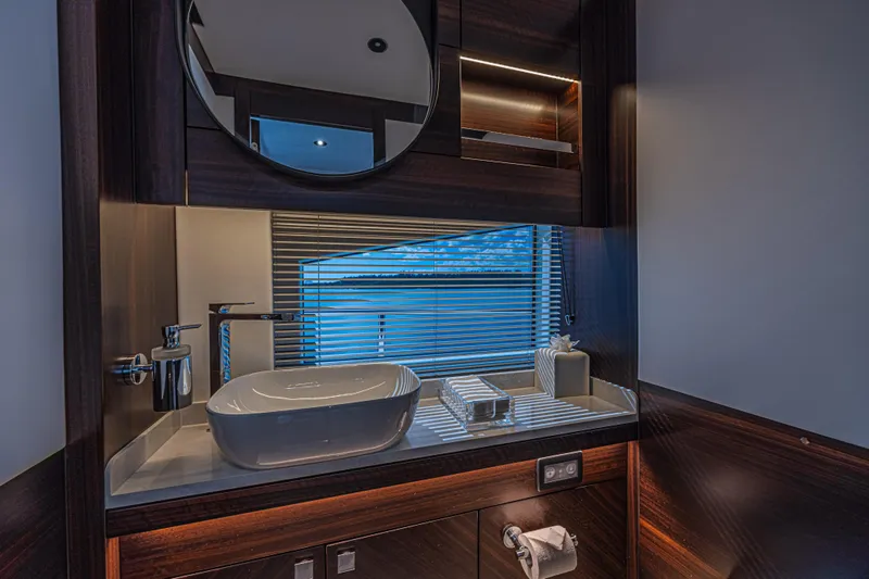 Slide: The Image of Luxurious bathroom interior of 2025 Sunseeker 88 Yacht with modern sink and mirror. - 50