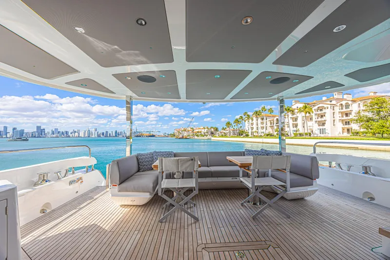 Slide: The Image of Luxurious Sunseeker 88 Yacht 2025 with scenic waterfront view and elegant outdoor seating. - 51