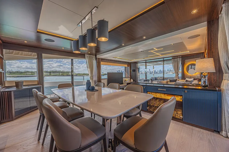 Slide: The Image of Luxurious interior of 2025 Sunseeker 88 Yacht with elegant dining area and panoramic windows. - 64