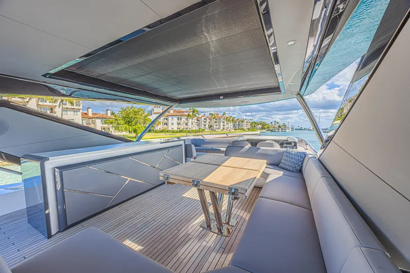 Slide: The Image of Luxurious Sunseeker 88 Yacht 2025 interior with elegant seating and scenic waterfront view. - 69