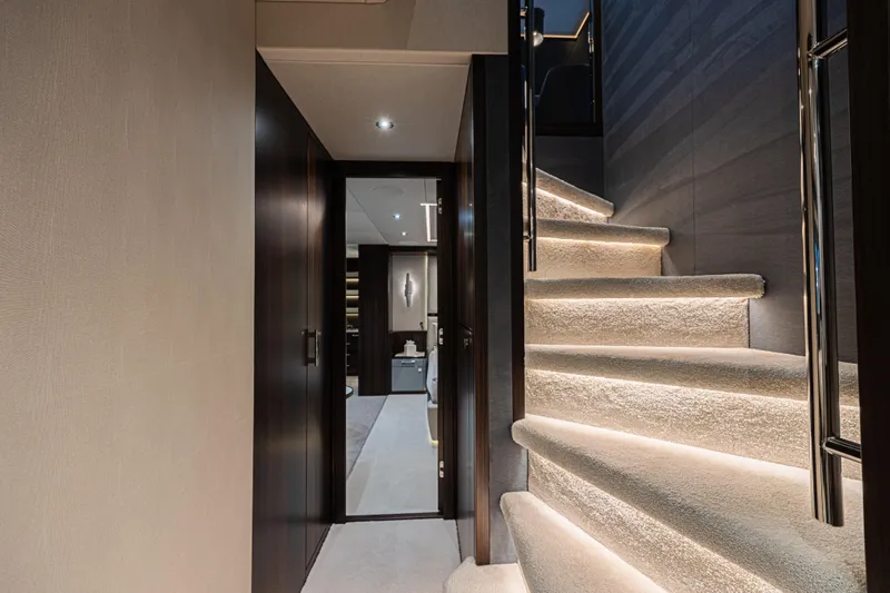 Slide: The Image of Luxurious interior staircase of 2025 Sunseeker 88 Yacht with elegant lighting. - 9