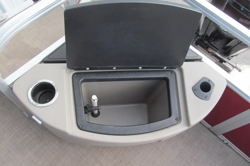 Slide: The Image of 2023 Sun Tracker Bass Buggy 18 DLX boat with open storage compartment and cup holder. - 14