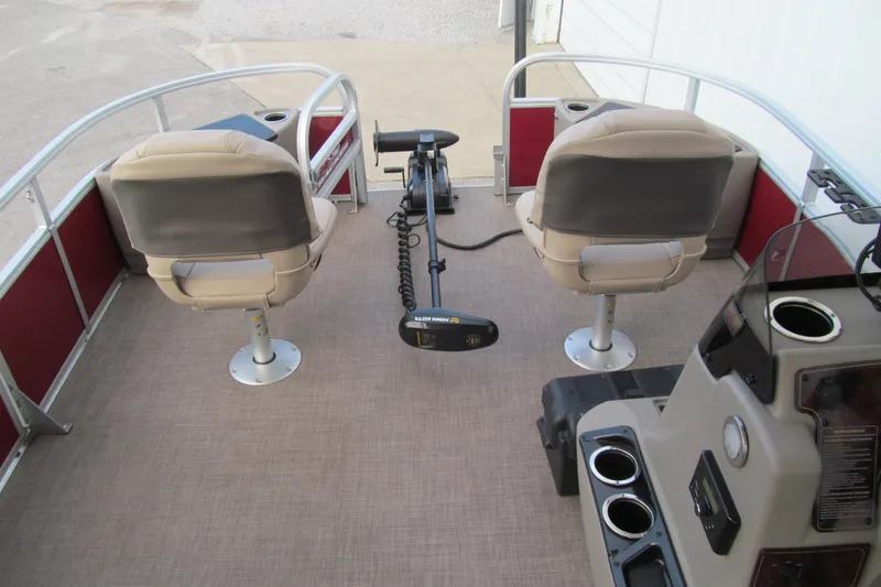 Slide: The Image of 2023 Sun Tracker Bass Buggy 18 DLX interior with seating and control panel. - 6