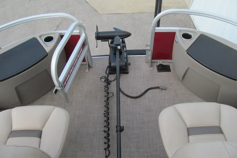 Slide: The Image of 2023 Sun Tracker Bass Buggy 18 DLX pontoon boat interior with seating and motor. - 8