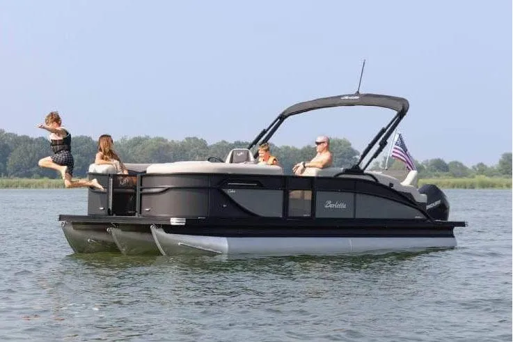 Slide: The Image of Manufacturer Provided Image: 2026 Barletta Cabrio 22UC pontoon boat on water, people enjoying leisure activities. - 3