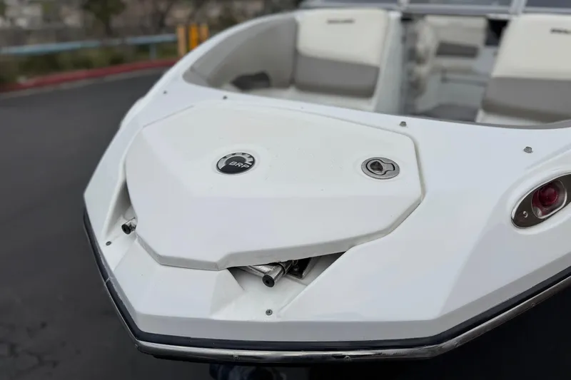 Slide: The Image of 2012 Bombardier Sea Doo 210 Challenger boat, white exterior, close-up view. - 11