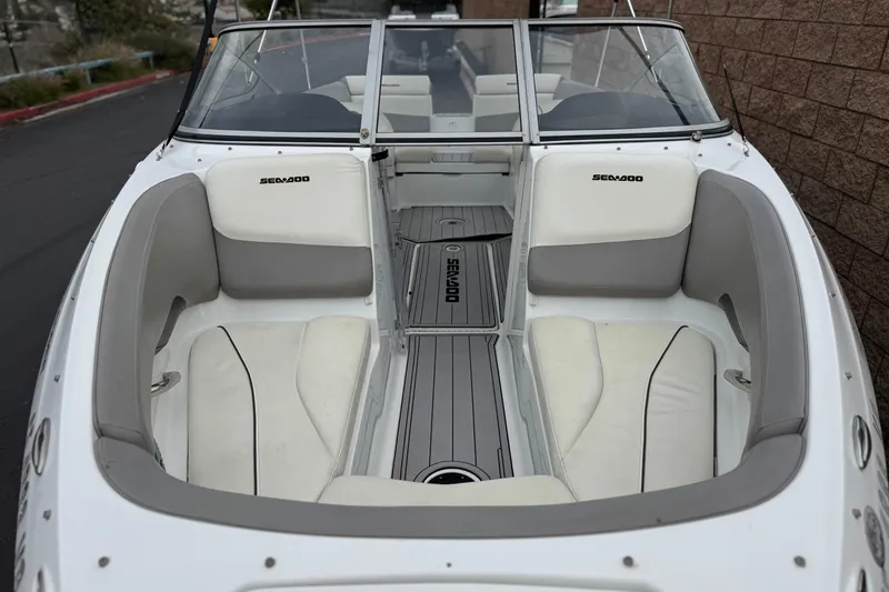 Slide: The Image of 2012 Bombardier Sea Doo 210 Challenger boat interior with white and gray seating. - 13