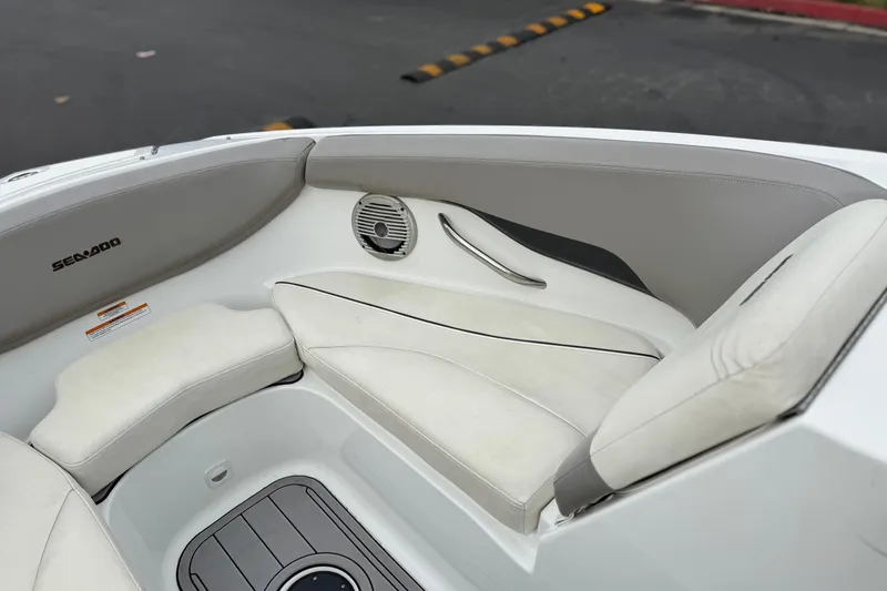 Slide: The Image of 2012 Bombardier Sea Doo 210 Challenger interior with white seating and speaker. - 16