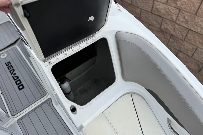 Slide: The Image of 2012 Bombardier Sea Doo 210 Challenger storage compartment with open hatch and visible fire extinguisher. - 17