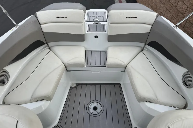 Slide: The Image of 2012 Bombardier Sea Doo 210 Challenger interior with white seating and gray flooring. - 19