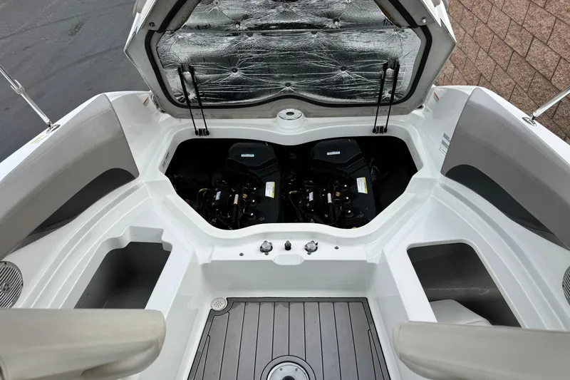 Slide: The Image of 2012 Bombardier Sea Doo 210 Challenger engine compartment with open hatch, showcasing dual engines. - 20