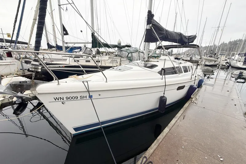 The Image of 2001 Hunter 340 sailboat docked at marina, side view. - 0