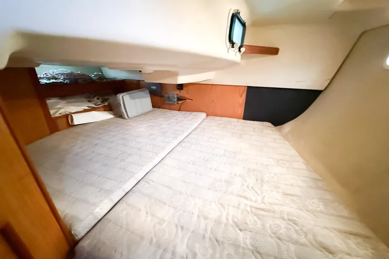 Slide: The Image of Interior cabin of 2001 Hunter 340 sailboat with cozy sleeping area. - 15