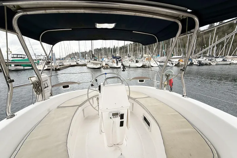 Slide: The Image of Cockpit view of 2001 Hunter 340 sailboat docked in a marina. - 2