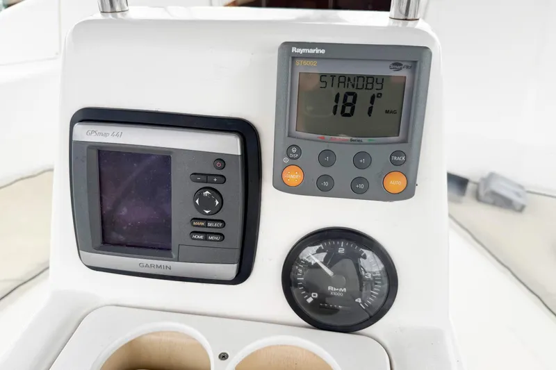 Slide: The Image of Control panel of a 2001 Hunter 340 sailboat with Garmin GPS and Raymarine instruments. - 21