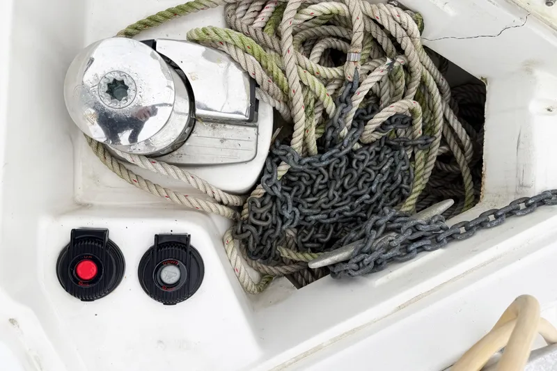 Slide: The Image of Anchor chain and ropes on a 2001 Hunter 340 sailboat deck. - 25