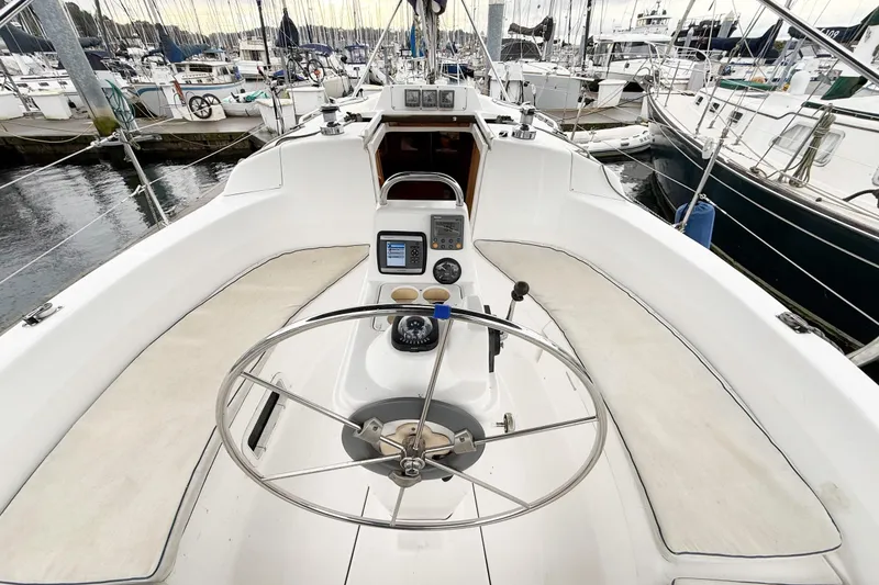 Slide: The Image of Cockpit of a 2001 Hunter 340 sailboat with steering wheel and navigation instruments. - 5