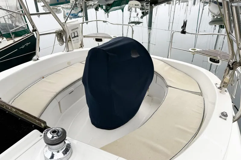 Slide: The Image of Cockpit of a 2001 Hunter 340 sailboat with covered steering wheel and cushioned seating. - 7