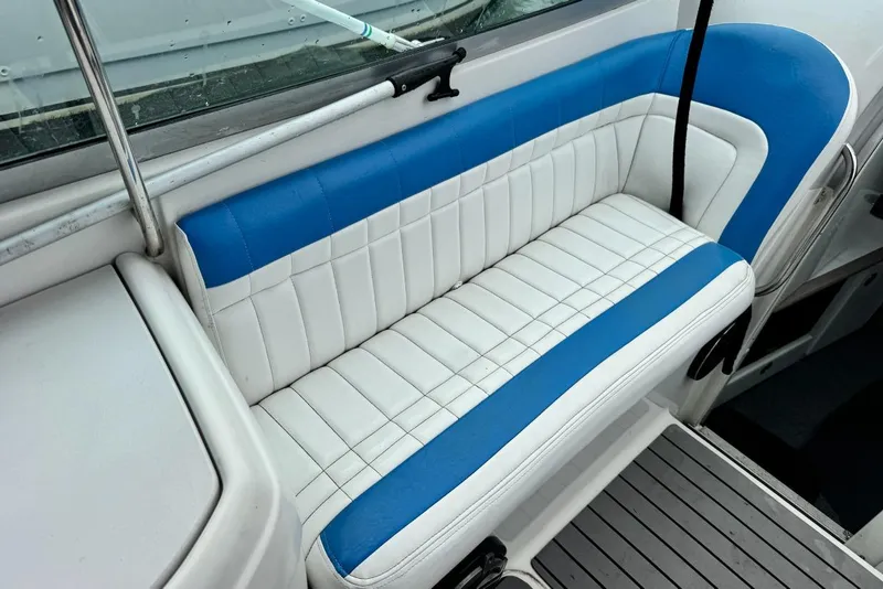 Slide: The Image of White and blue seating on a 1998 Formula 330 Sun Sport boat. - 10